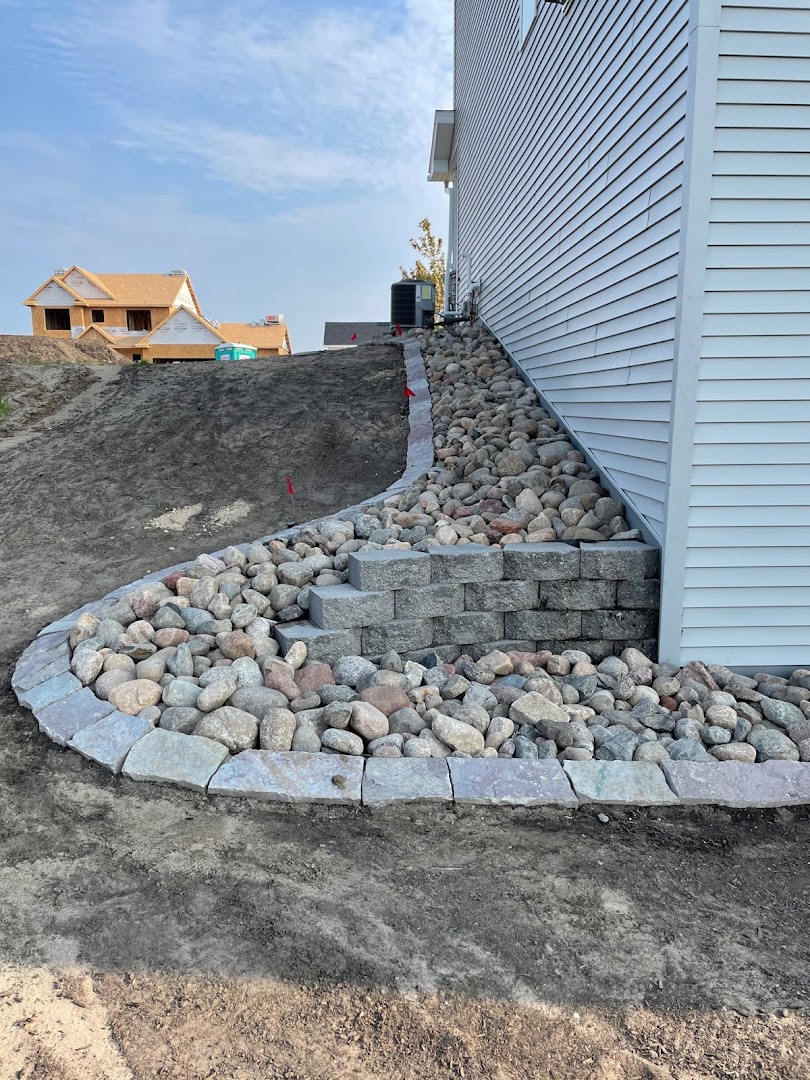 Decorative rock border bed along a home, Andover MN