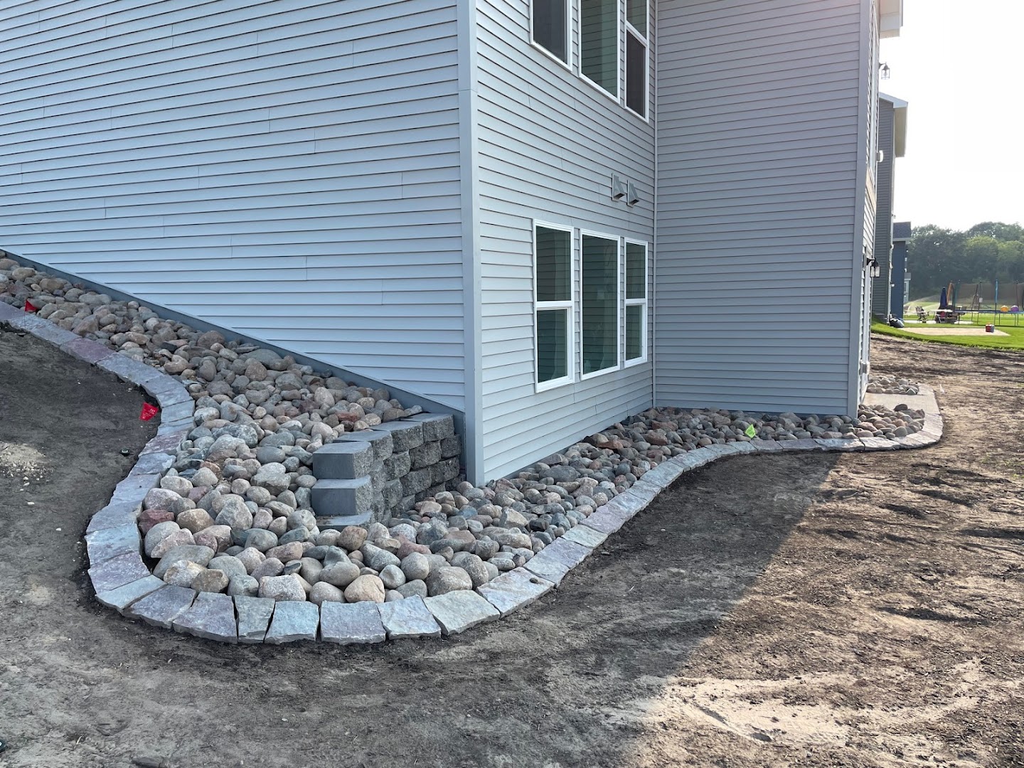 River-rock border along a home, Andover MN